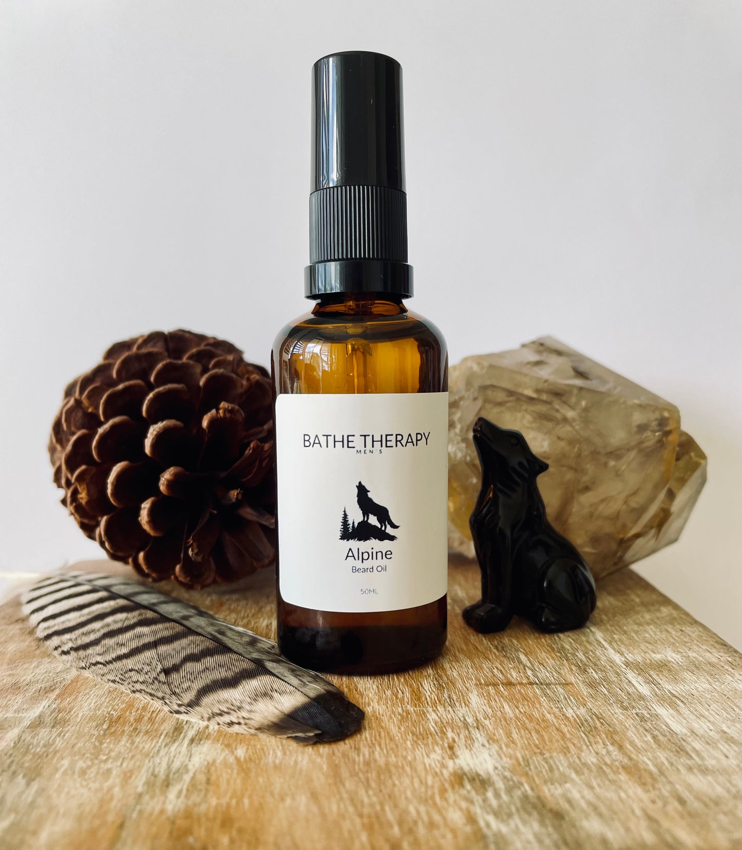 Bottle of Alpine Beard Oil from Bathe Therapy in amber bottle with wolf