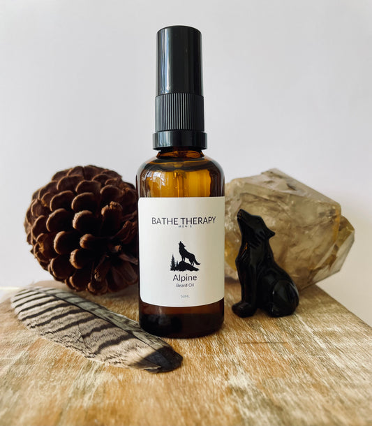 Bottle of Alpine Beard Oil from Bathe Therapy in amber bottle with wolf 